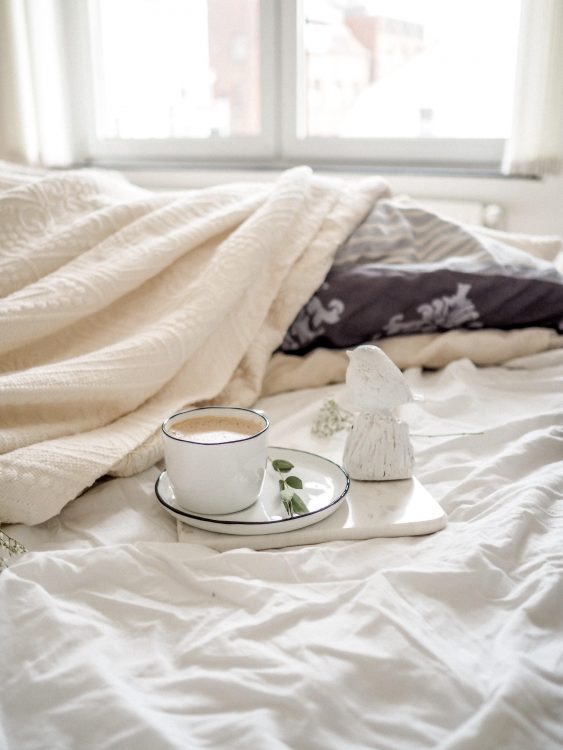 Double bed with cup of tea