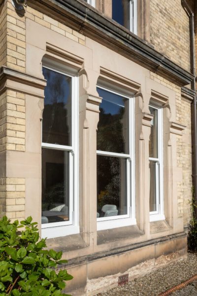 white vertical sliding windows at Foxhill house