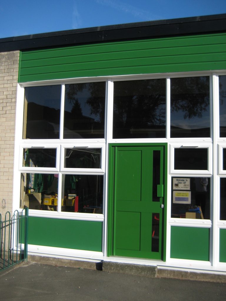 White uPVC windows Green aluminium door