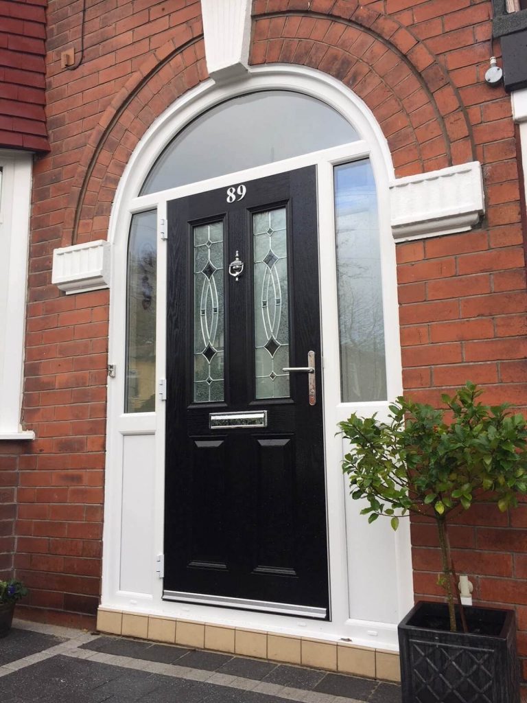 Black composite door with arched toplight and sidelight