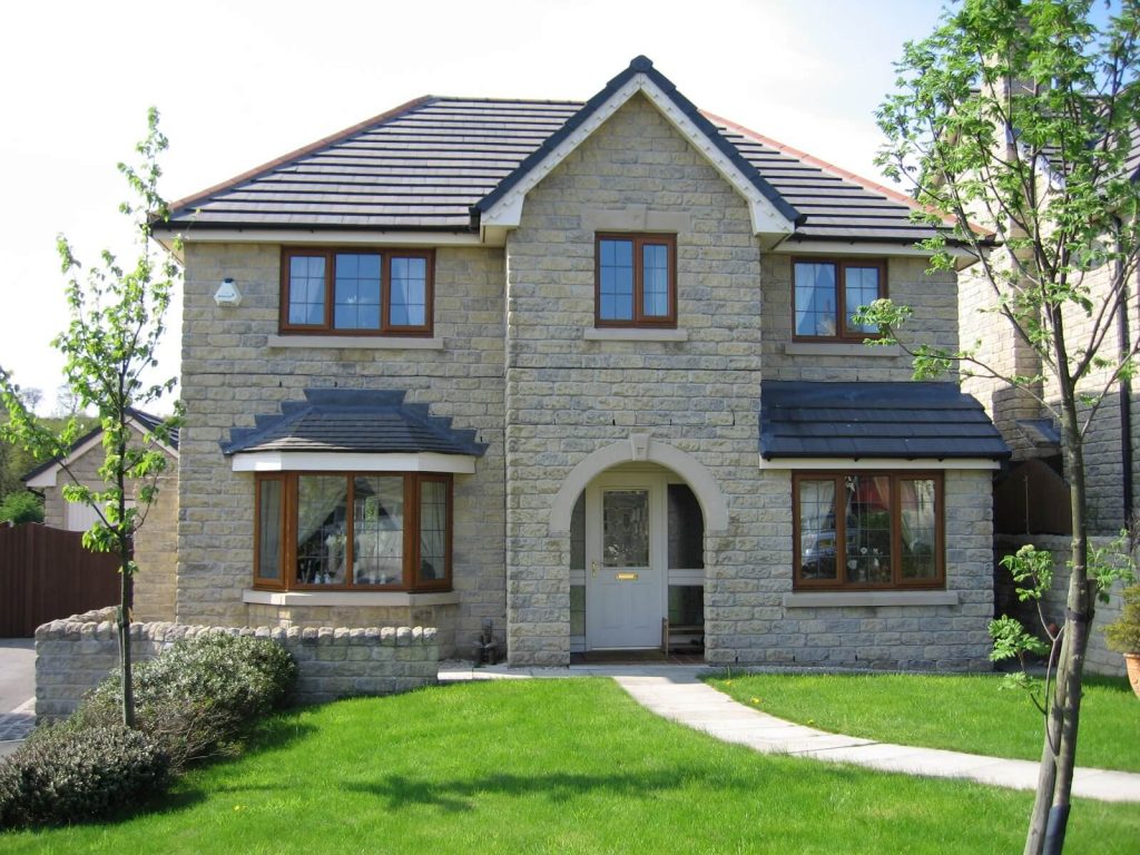 Golden oak on white uPVC casement windows