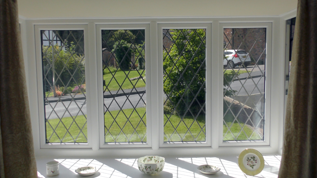 Mr and Mrs Small white windows.